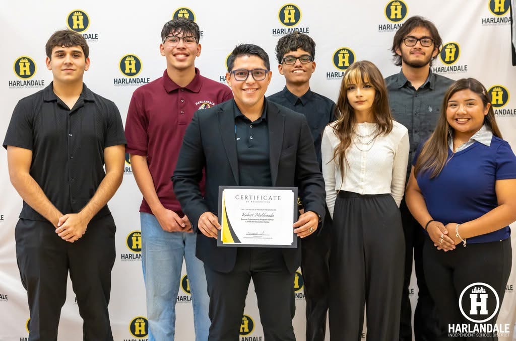Students participating in a We Can Change IT program and receiving recognition for their work.